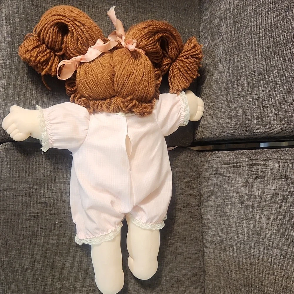 Charming Pink Doll with Curly Brown Hair